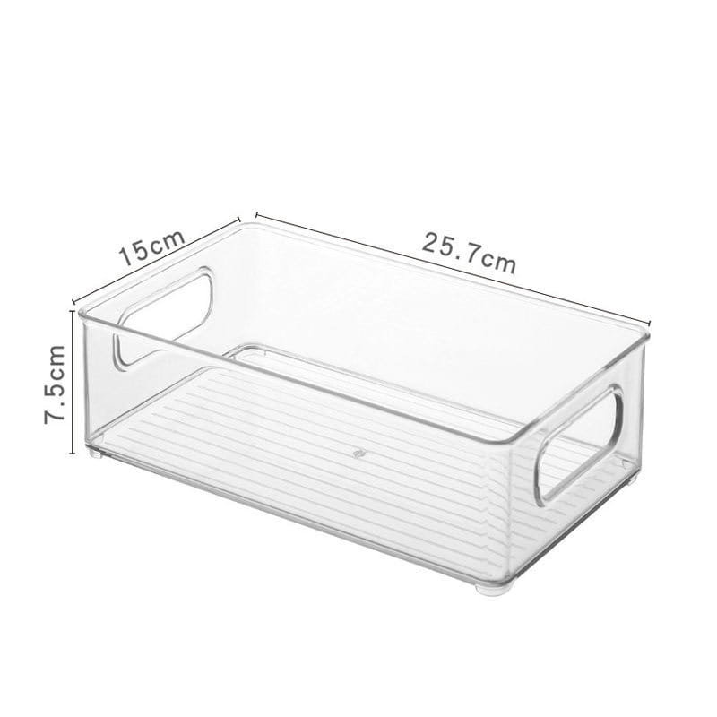 Organizador de maquillaje de plástico transparente y recipiente de almacenamiento para cajones con asas integradas y un interior acanalado para un almacenamiento resistente.