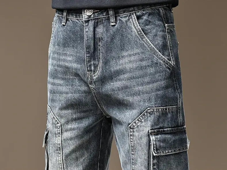 baggy dark wash denim cargo pants with reinforced stitching and large side pockets made from dark-wash denim material.