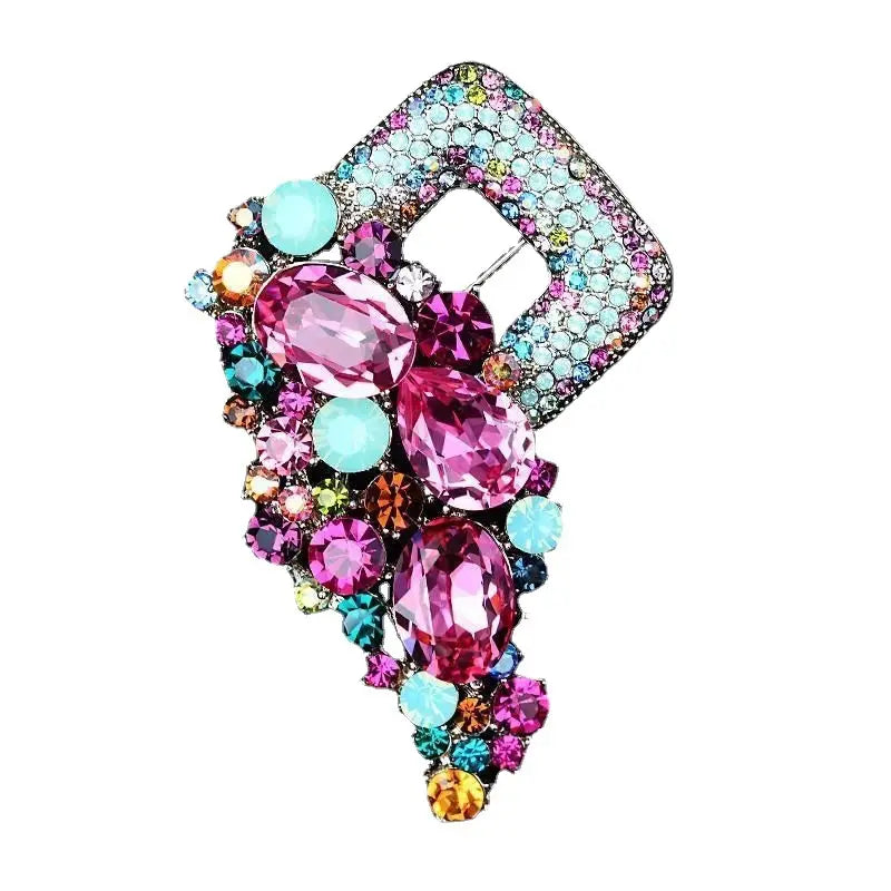 A vibrant crystal flower brooch pin for women featuring a diamond-encrusted geometric frame with sparkling pink and turquoise rhinestones.