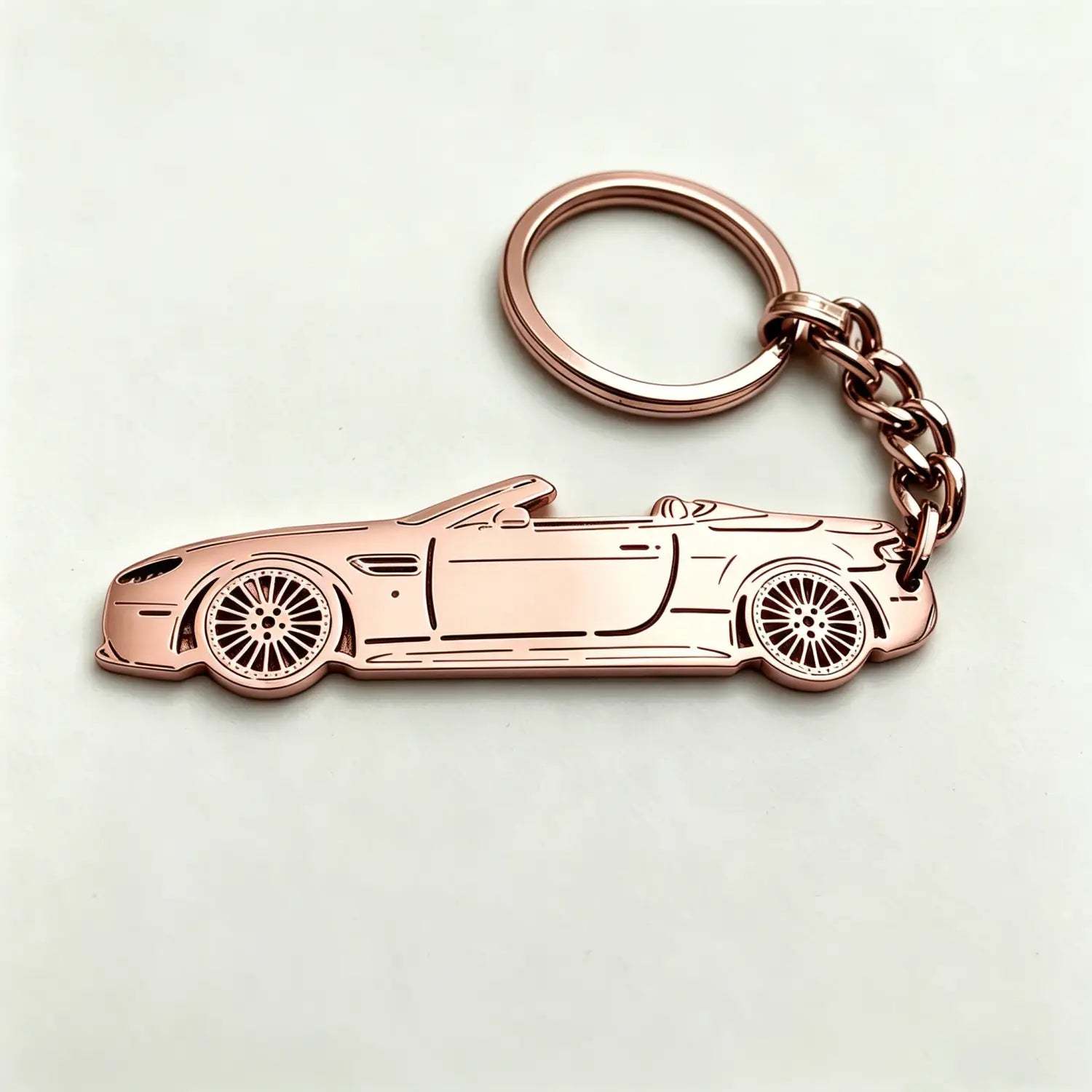Rose gold metallic custom car model keychain shaped like a convertible sports car for personalized vehicle key pendant.