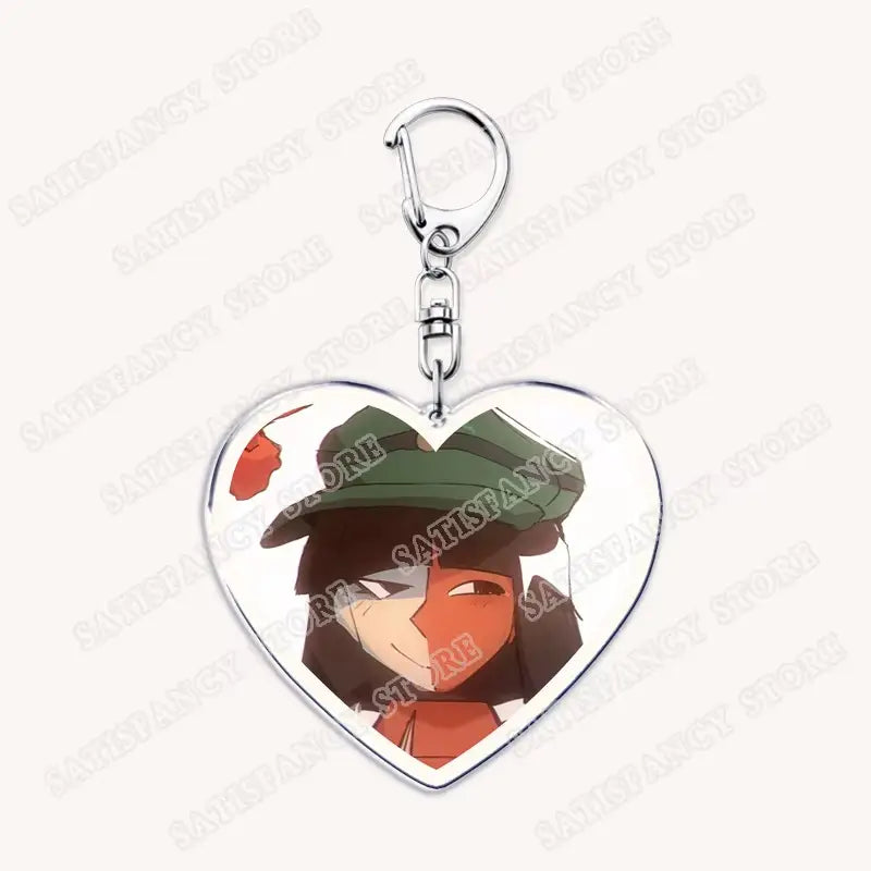 Herzförmiger Acryl-Schlüsselanhänger mit einem Cartoon-Charakter mit dunklem Haar, grüner Mütze und orangefarbener Halbmasken-Gesichtsseite, konzipiert als Geschenk für Anime-Gamer.