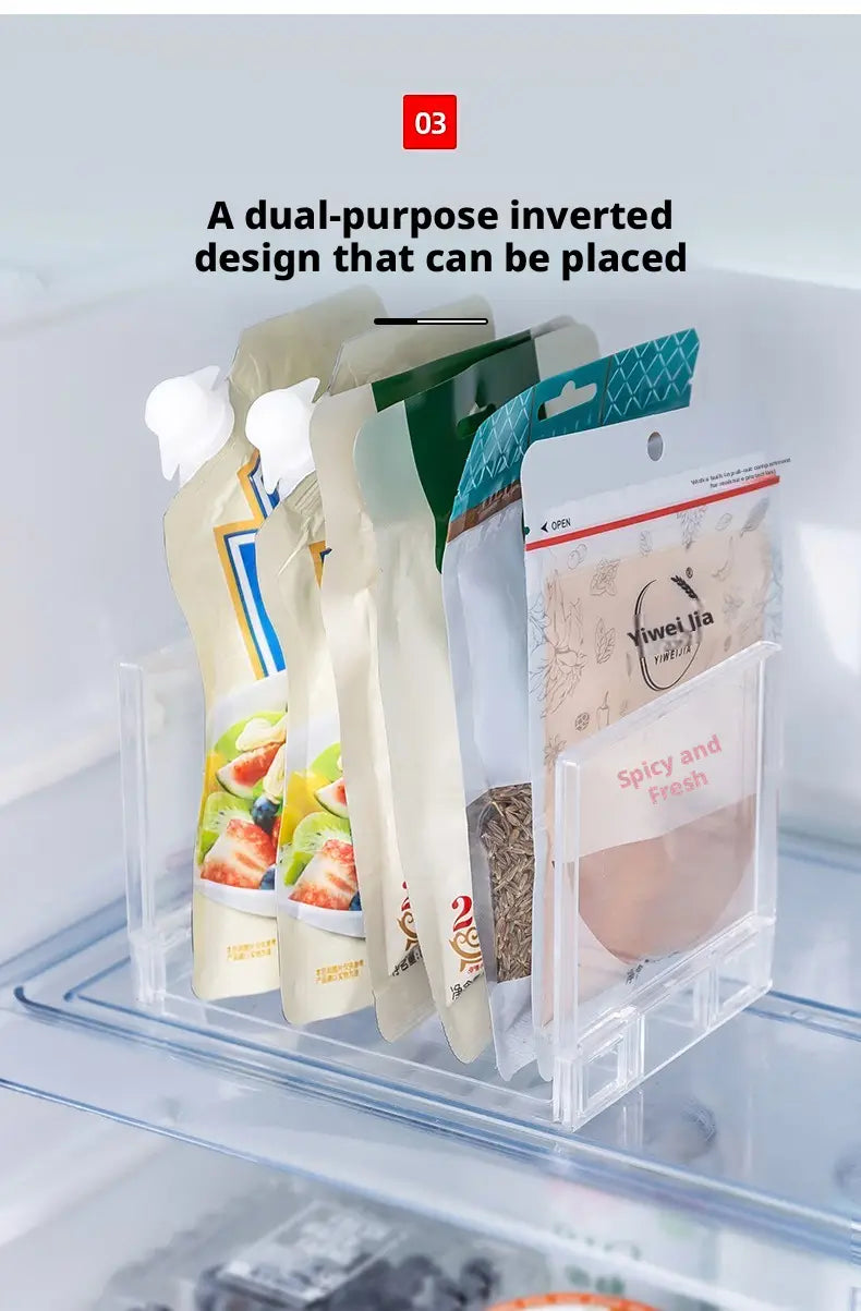 Clear expandable cabinet organizer and spice rack made of clear plastic holding multiple food pouches in a refrigerator.