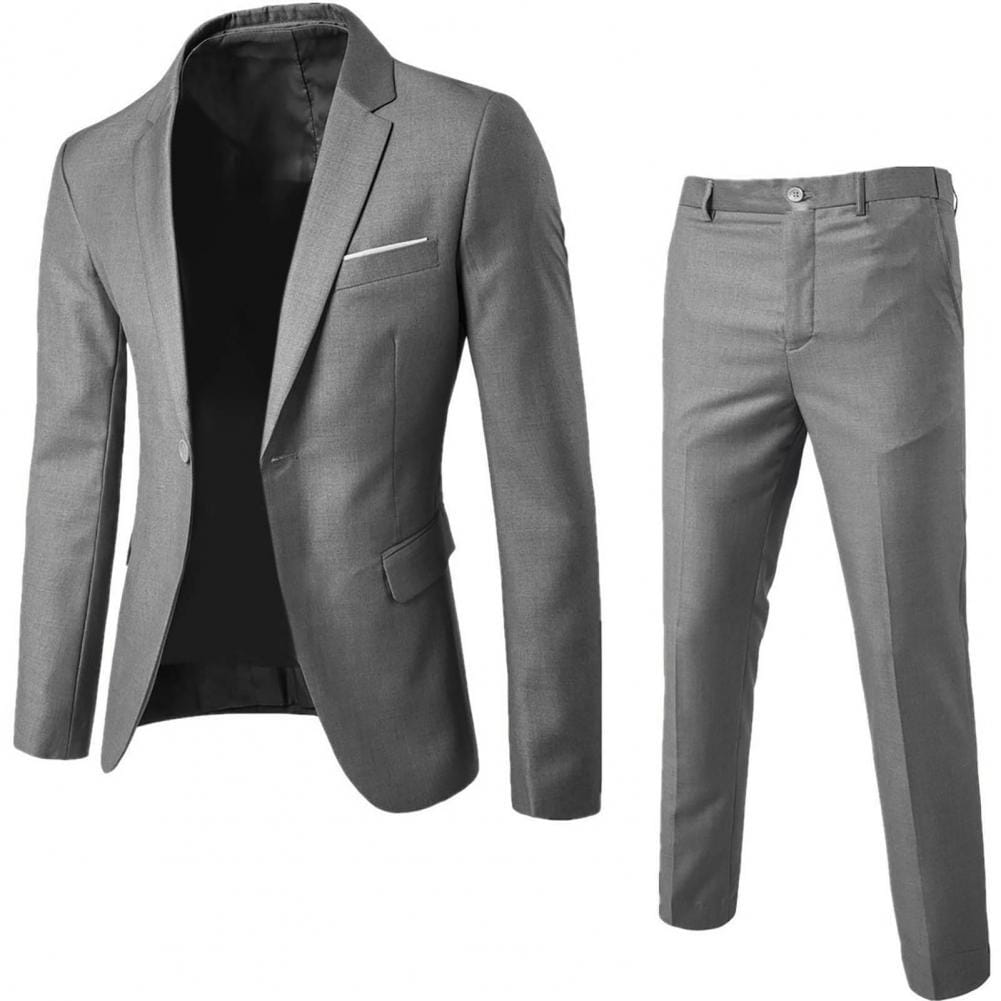 Conjunto de traje de hombre de color gris, de color sólido, corte slim fit, con chaqueta entallada de manga larga con solapas tipo pico y pantalones entallados a juego con el largo ideal de los pantalones para uso formal.