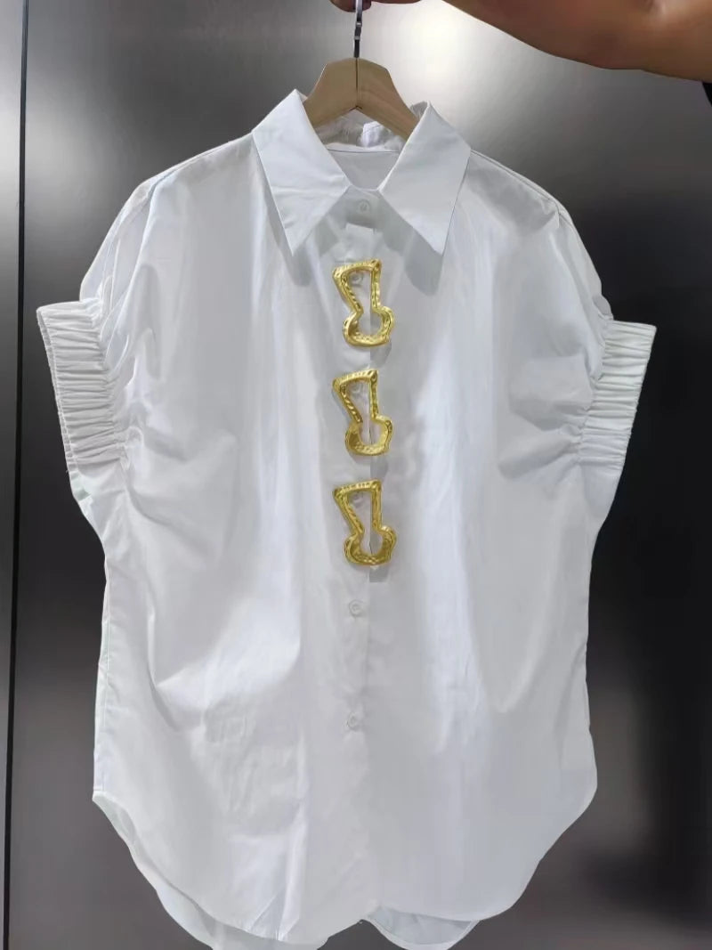 White short-sleeve shirt with turn-down collar featuring gold-tone sculpted button accents and ruched cuffs, offering a fashionable versatile design for casual wear.