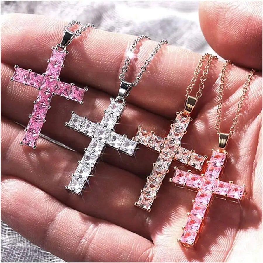 Three sparkling cross pendants with rectangular-cut pink and clear crystals set on silver-toned and rose gold-tone chains featured as fashion necklaces female and necklaces female pendants in a female pendants gold collection.
