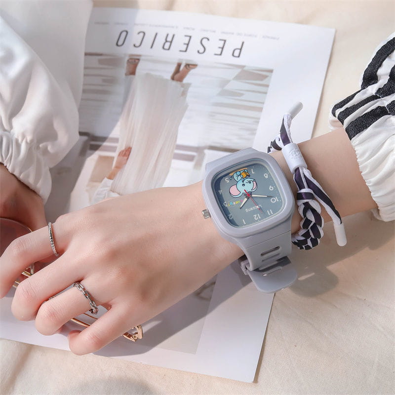 Gray luminous kids digital watch with a square face featuring a cartoon elephant design and a matching gray silicone strap.