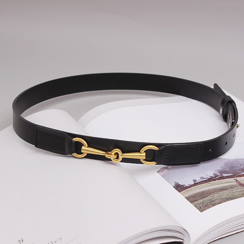 Black leather belt for women with gold-tone horsebit buckle displayed on the front side.