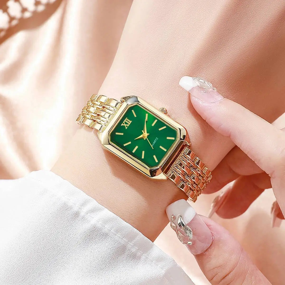 Women gold rectangle quartz watch with a vibrant green dial, roman numeral hour markers, and an elegant gold mesh strap.