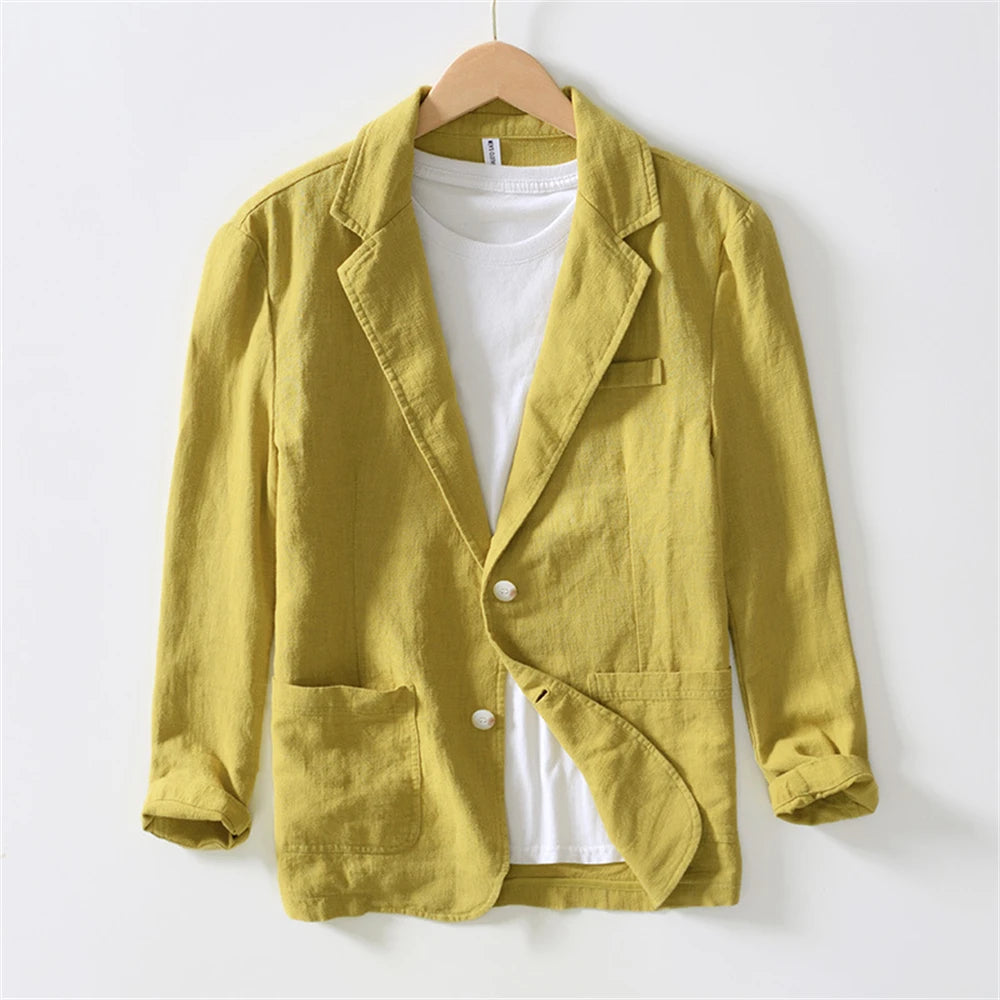 A men’s lightweight linen casual blazer jacket in mustard yellow featuring a single-breasted design with two front pockets and white buttons.