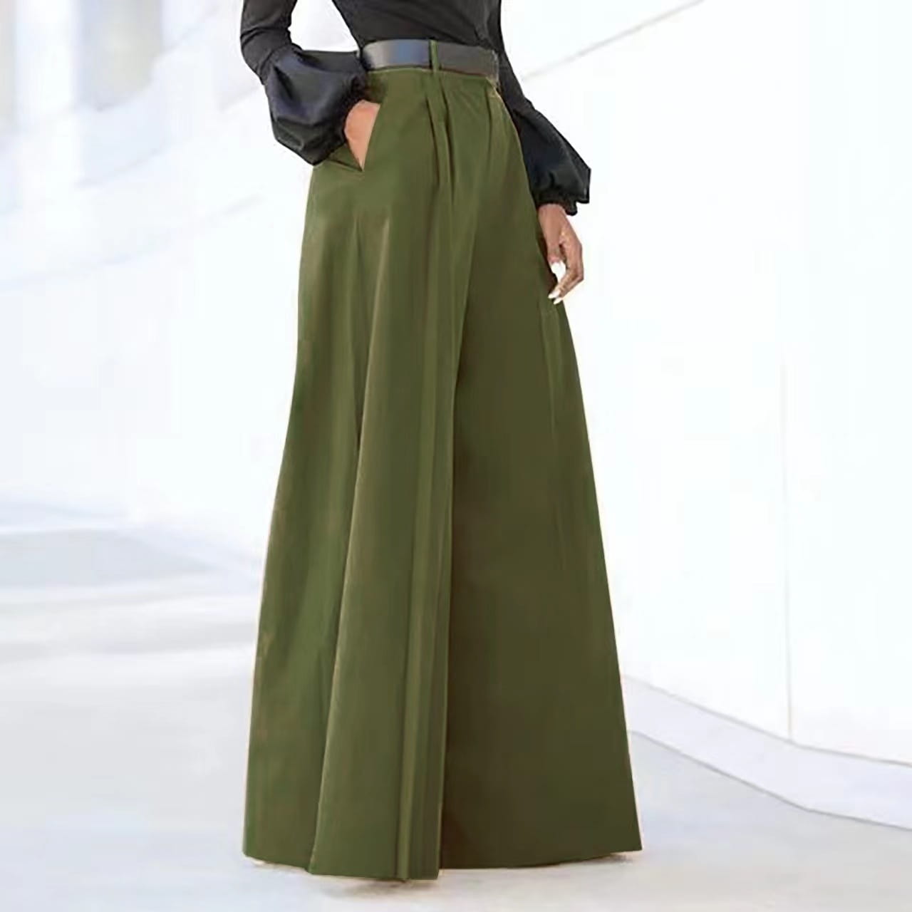 Olive green wide leg high waist tailored trousers with a sleek fit and subtle pleats at the waist.
