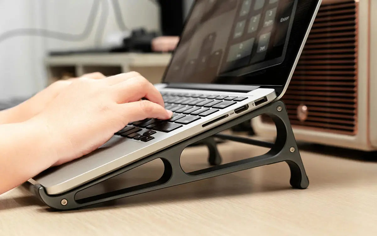 black metal laptop stand with sleek minimalist design and sturdy support arms shown from the back in the Orico portable aluminum laptop stand and desktop riser product