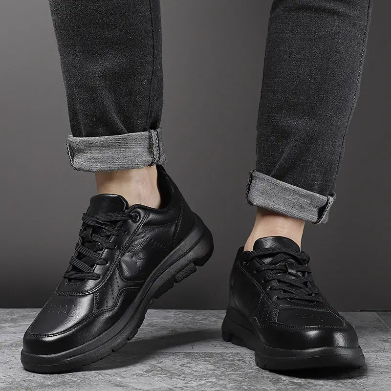 Men black leather chunky sole sneakers featuring a sleek modern design and sturdy rubber soles.