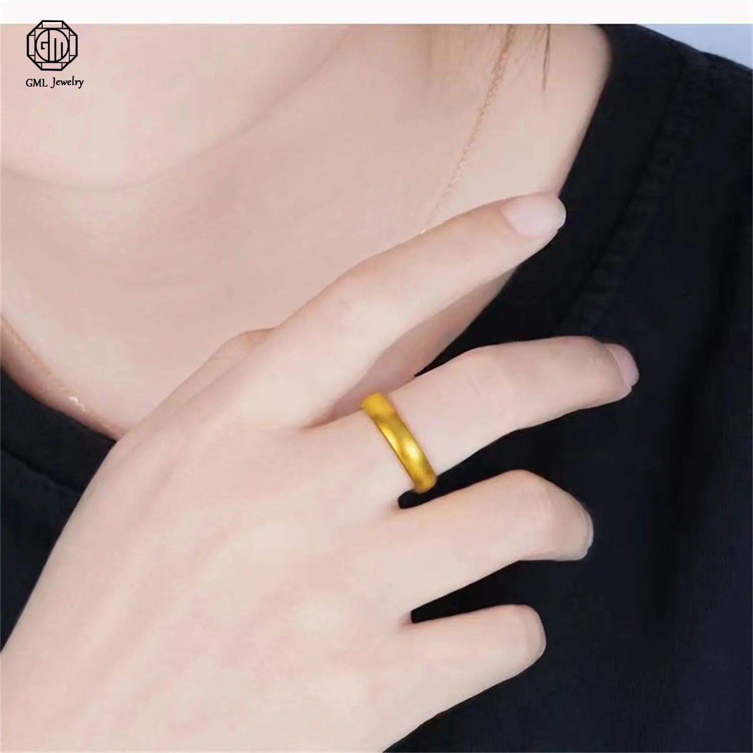 A sleek solid gold sand gold adjustable ring with a smooth slightly textured matte wide band worn on the finger showcasing a fade resistant gold adjustable ring design.