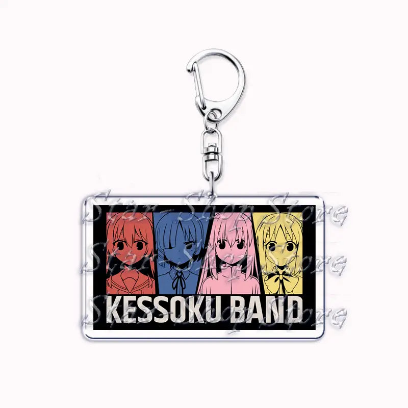 Rectangular acrylic anime character keychain featuring four kessoku band characters in red blue pink and yellow against a black background with white text for bocchi the rock merchandise.