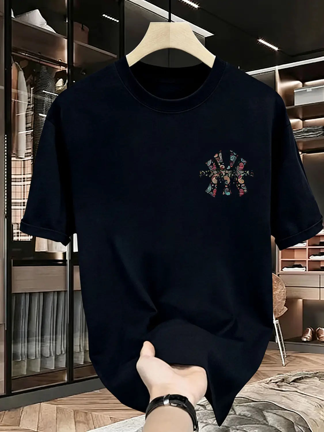 mens summer printed graphic t shirt in black short-sleeved cotton featuring a colorful embroidered graphic on the chest.