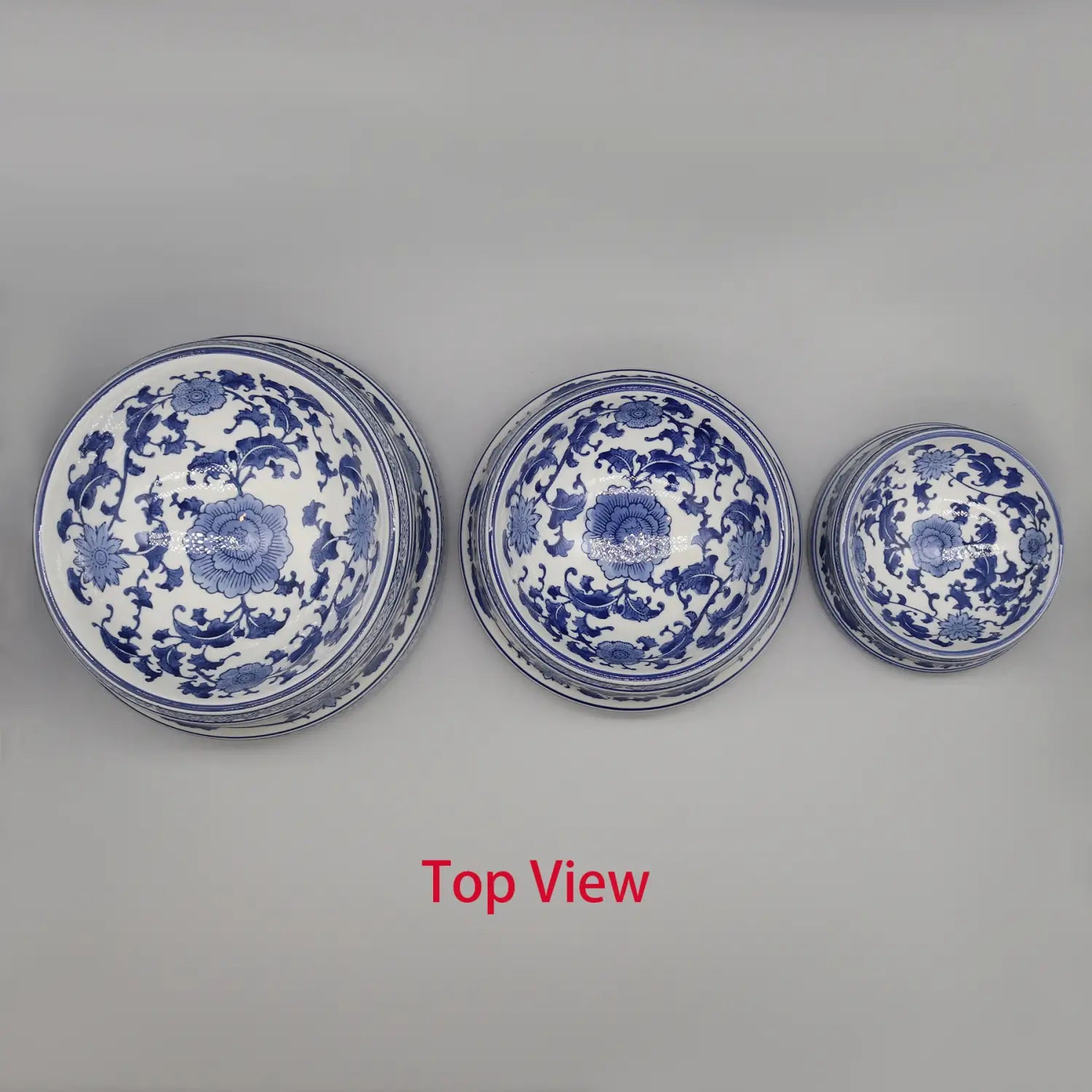 Three stacked blue and white feeding bowl ceramic set featuring intricate floral patterns in porcelain material.