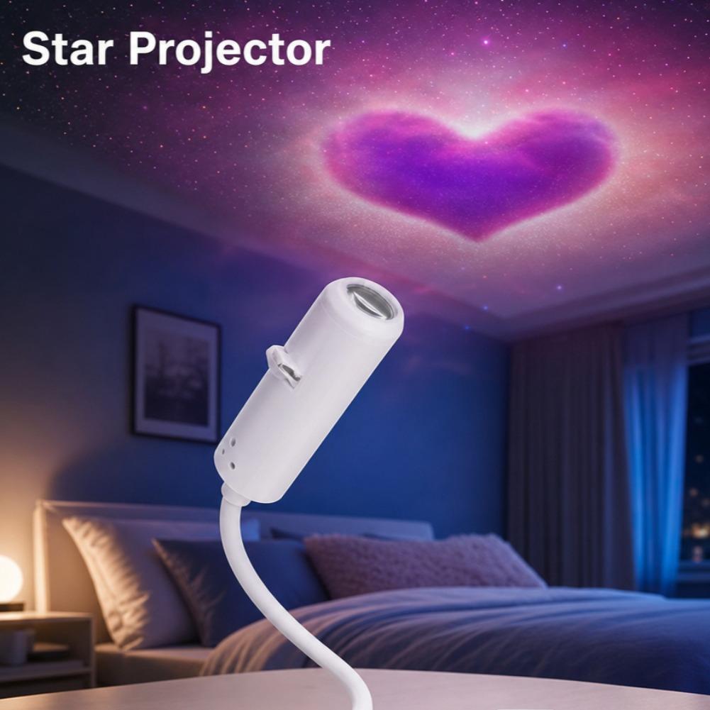 White cylindrical usb starry night light with a flexible neck casting a purple heart-shaped galaxy pattern on the ceiling using interchangeable film discs.