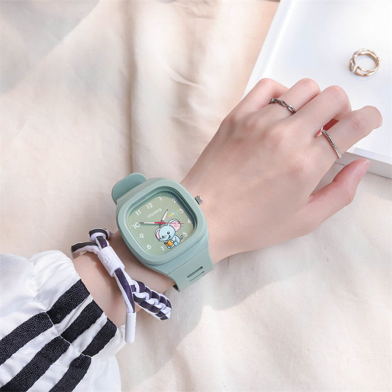 Kids luminous cartoon elephant digital watch with a mint green square face featuring a cartoon character on the dial and a matching silicone strap.