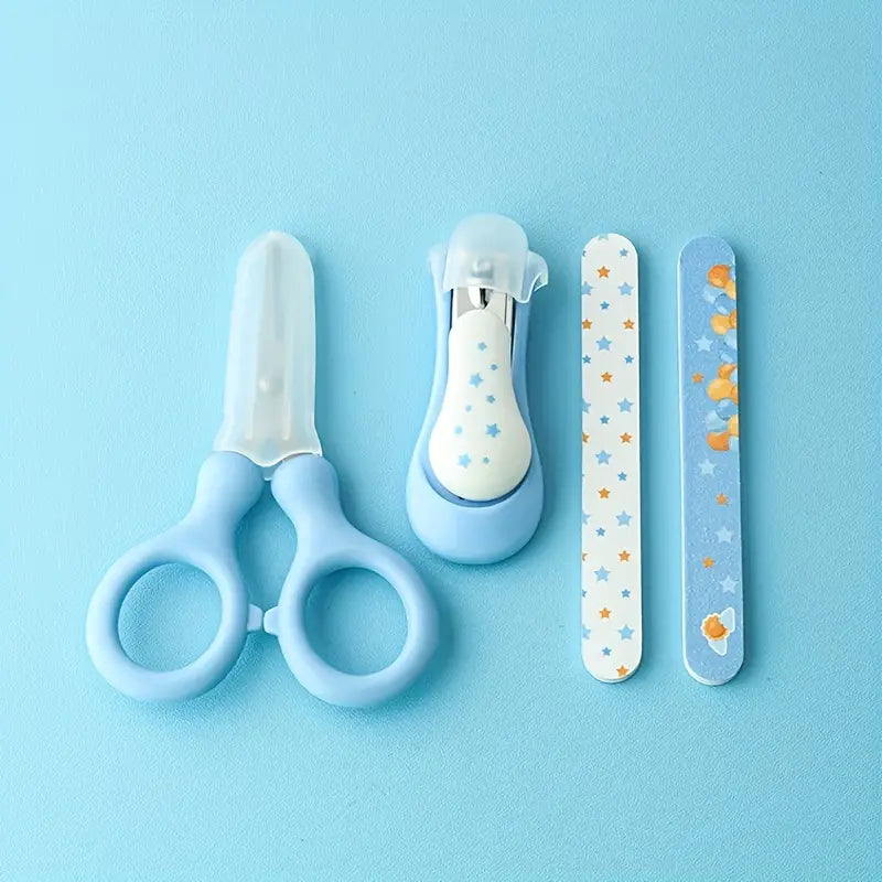Light blue baby nail care set 4-piece grooming kit including infant scissors, nail clipper, and two star-patterned nail files designed for gentle infant nail trimming.