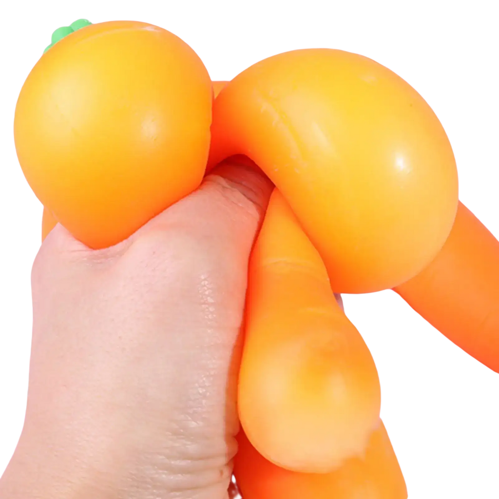 Orange carrot shaped slow rebound squeeze toy with green tops made of soft silicone shown from the front view