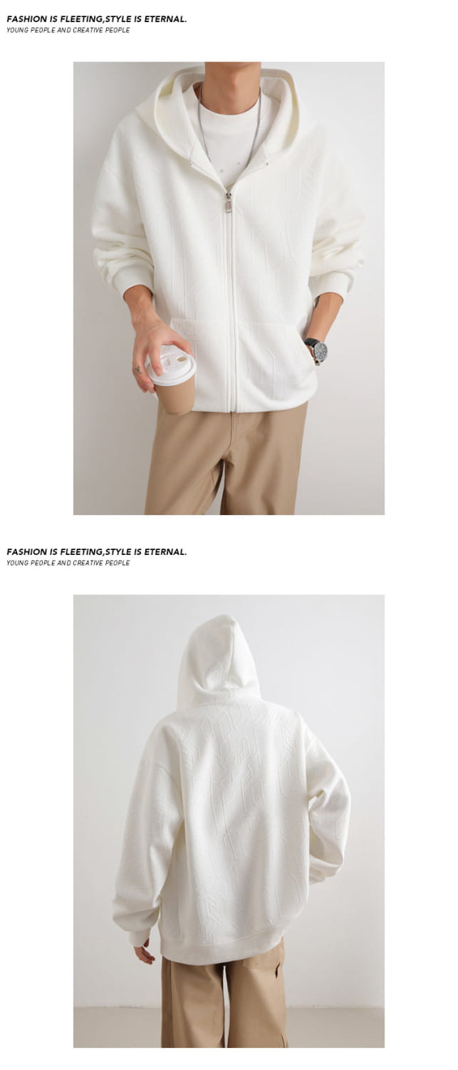 Mens black zip up hooded jacket made of soft casual fabric with a relaxed fit and cream-colored zip-up hoodie shown from the front.