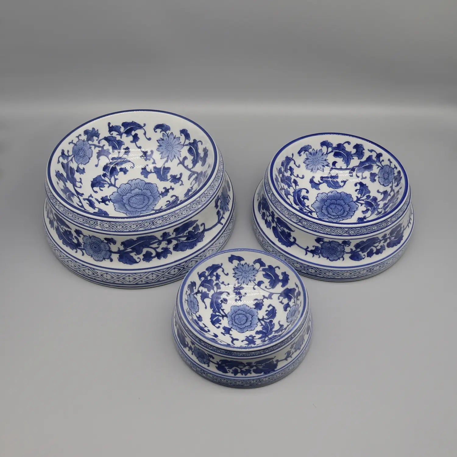 Three blue and white porcelain feeding bowl ceramic set featuring intricate floral patterns.