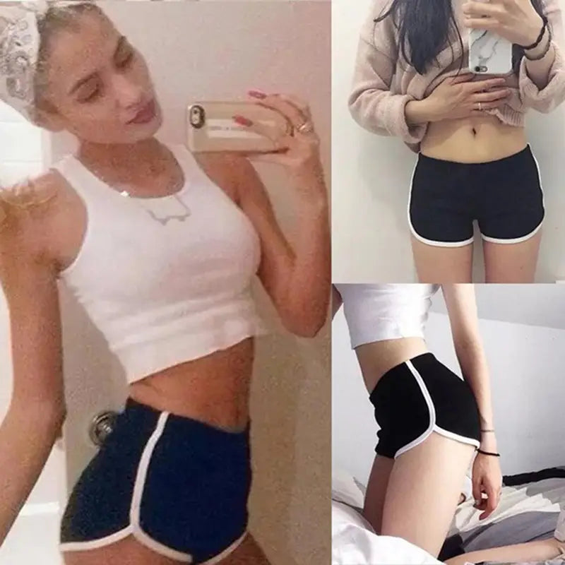 black sports shorts women with white trim and contrasting side stripe featuring an elastic waist for casual athletic use