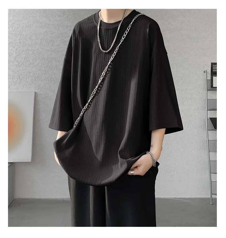 Black ribbed cotton men striped oversized summer t-shirt with three-quarter sleeves and a relaxed fit.