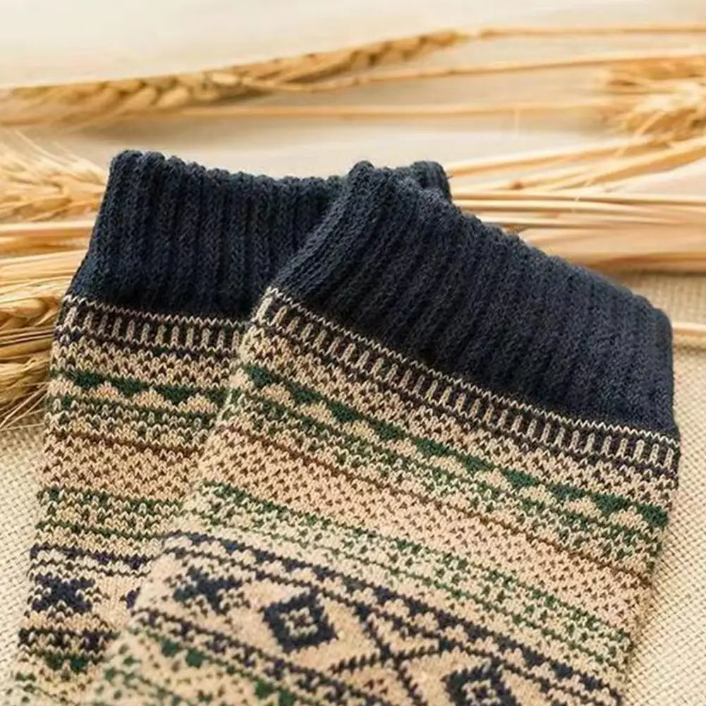 Men retro cotton crew socks in dark blue ribbed knit with beige green and navy geometric patterns on the mid-high tube section ideal for fashion trend and thermal wear.