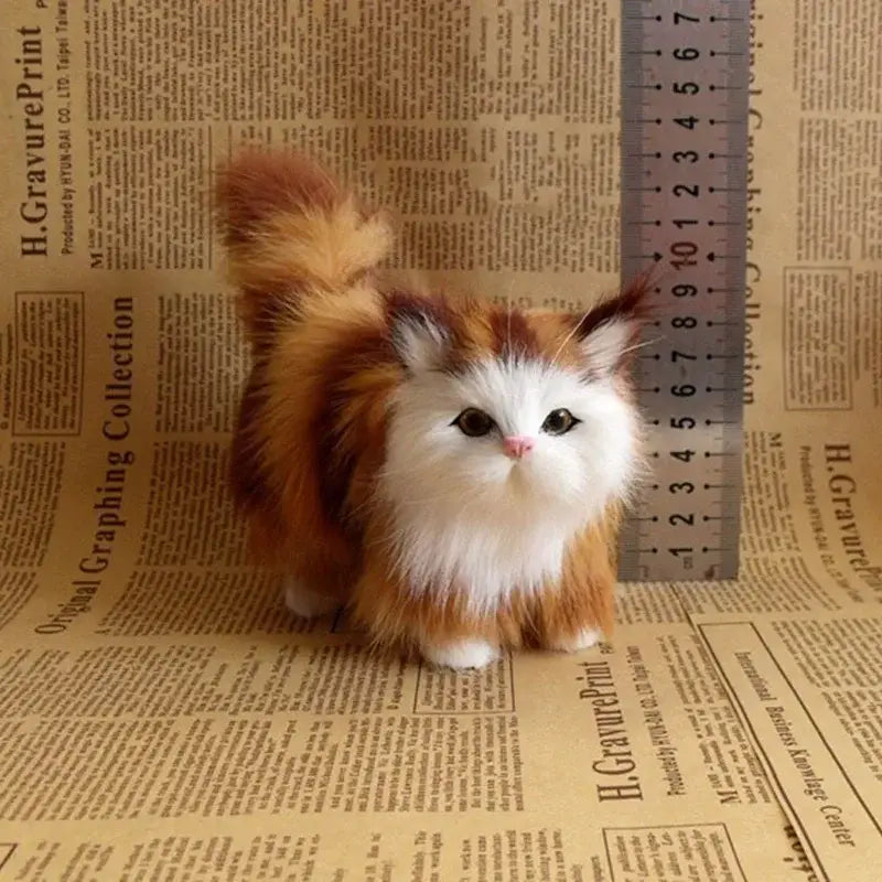 A fluffy orange and white simulation cat plush with detailed fur texture made of soft stuffed material for decorative or comforting use.
