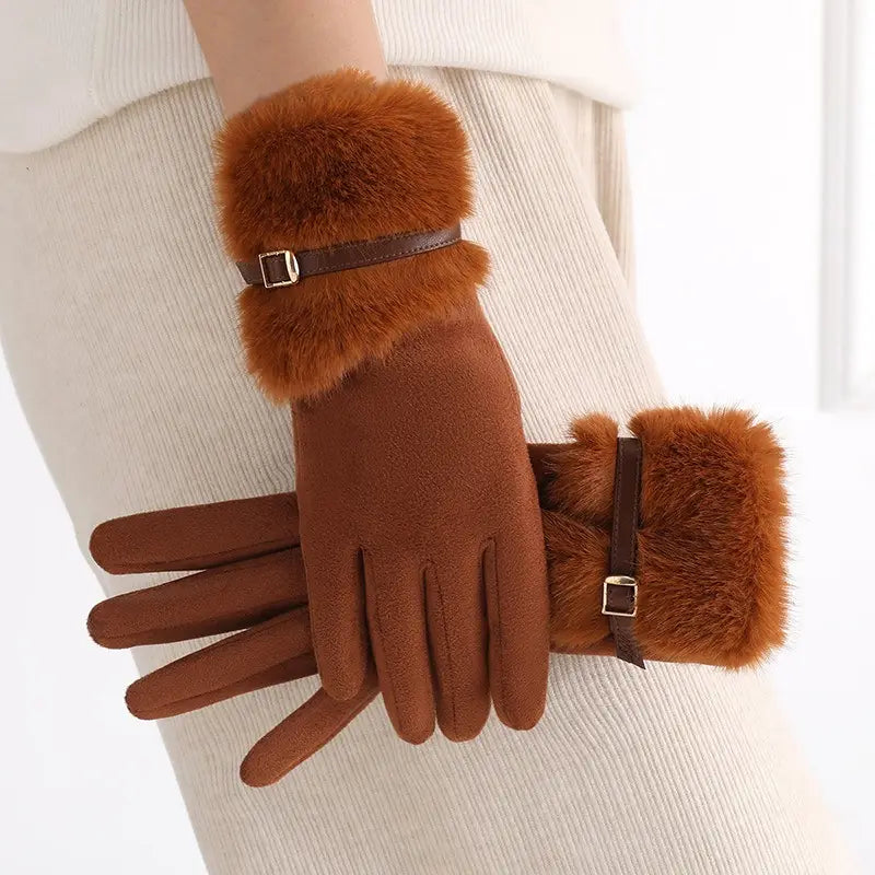 women’s touchscreen winter gloves in brown suede-like material with faux fur lining and adjustable brown leather straps with silver buckles shown from the back side
