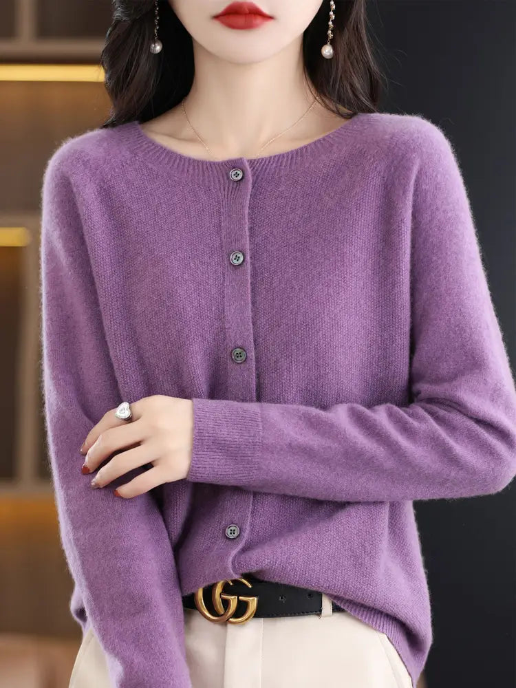 A soft lavender merino wool cardigan for women featuring a round neckline and button closure made of cashmere knit.