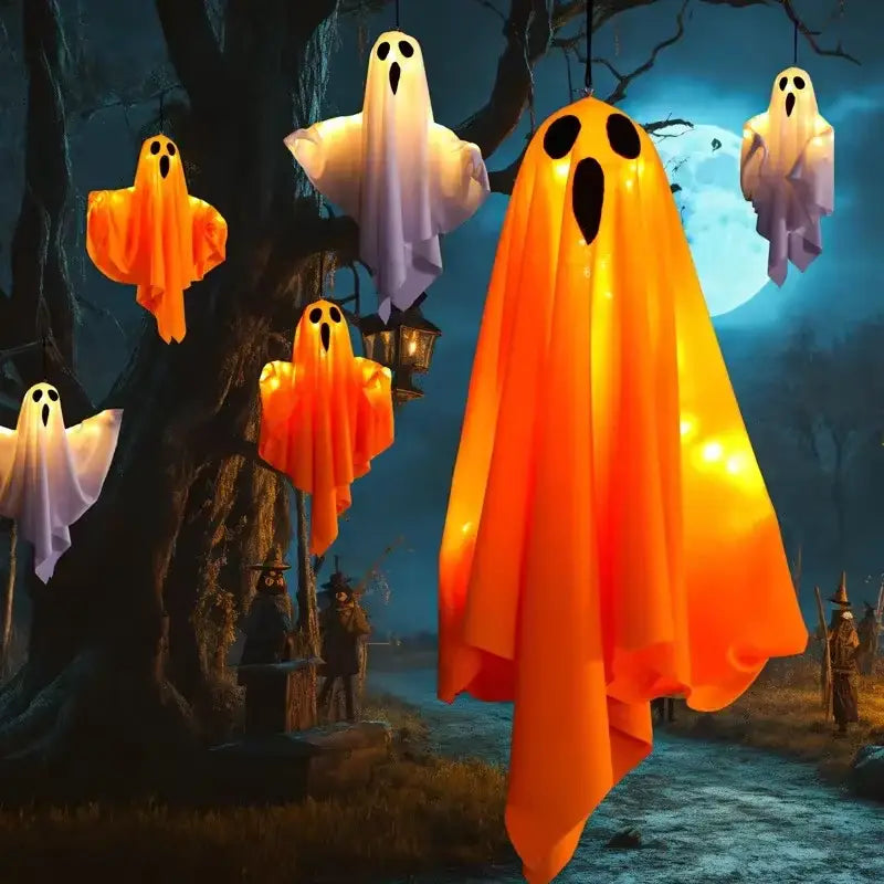 led hanging ghost halloween decoration glowing orange ghost lantern made of durable plastic hanging from a tree branch for outdoor spooky decor.