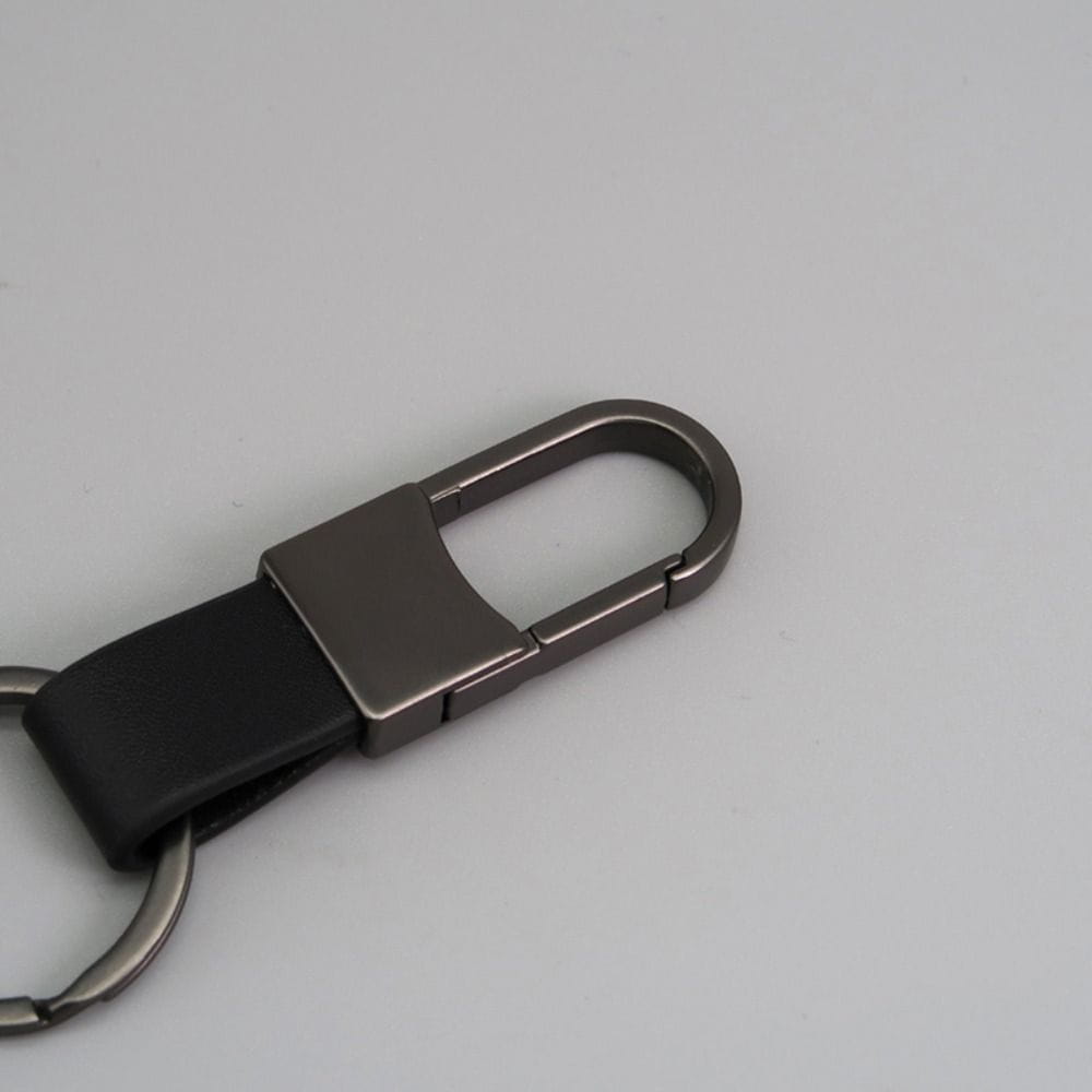 Black leather keychain carabiner with a matte-finished metal clip designed as an anti lost waist ring.