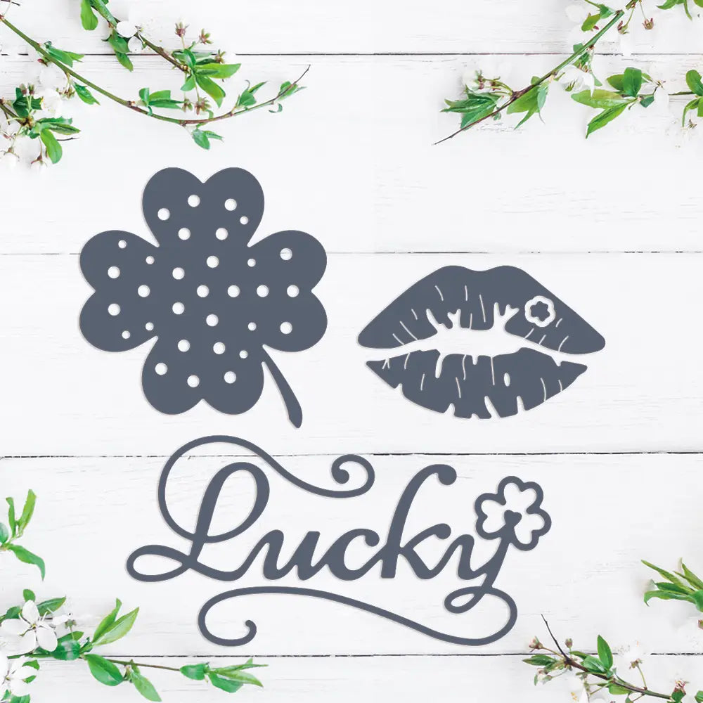Dark gray metallic Chinese New Year metal cutting dies set featuring a four-leaf clover with polka dots stylized lips and the word lucky in cursive script.