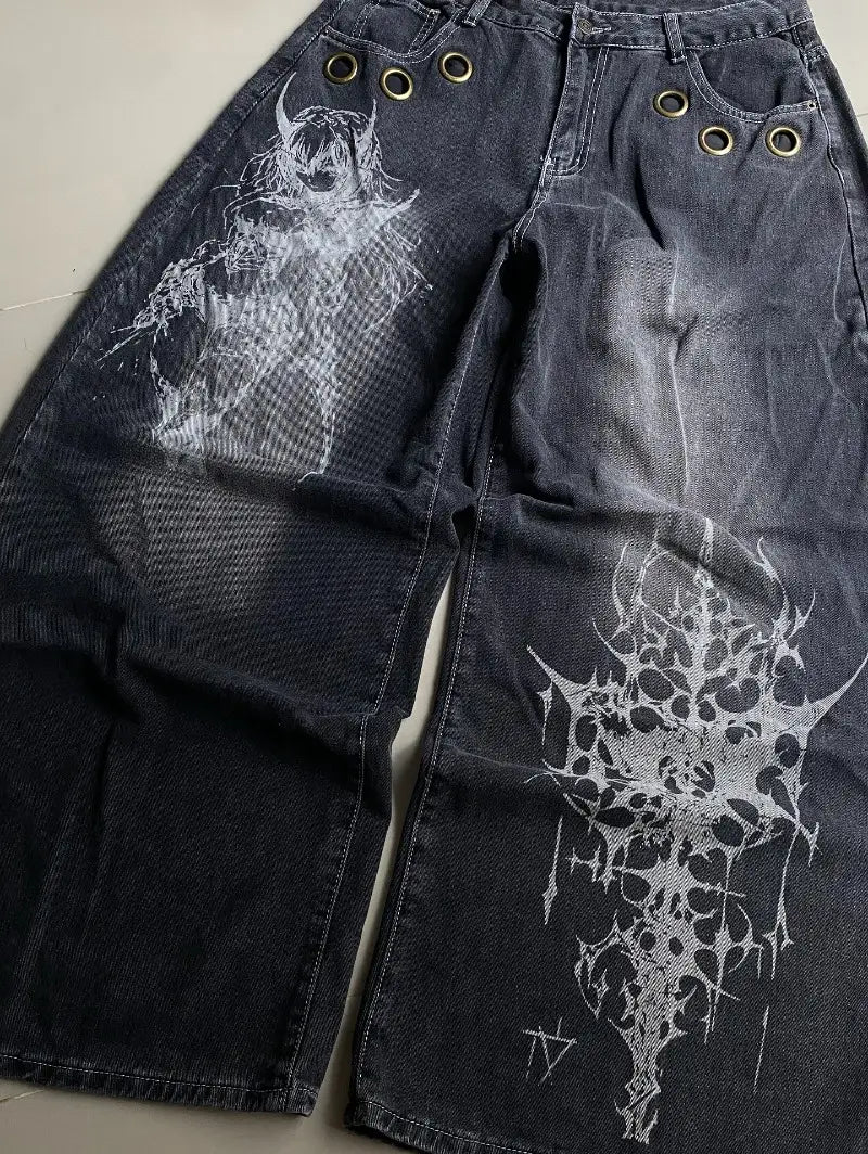 Dark wash denim Y2k gothic graphic wide leg jeans for men featuring bold white prints of a horned figure and intricate spiky design.