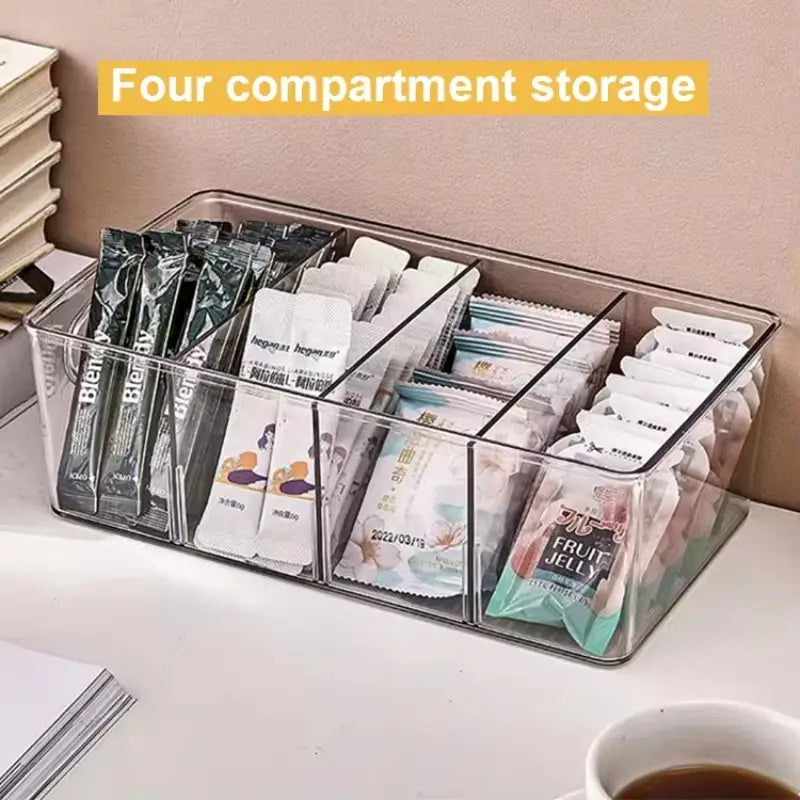 clear plastic food storage bin with four compartments and black dividers for pantry organization and food container storage bins.