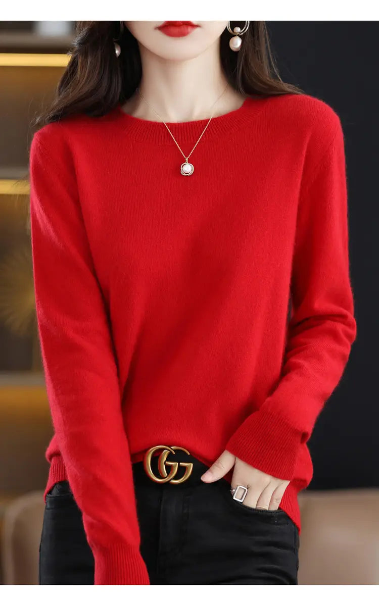 A vibrant red pure wool cashmere o-neck pullover sweater with long sleeves and ribbed cuffs.