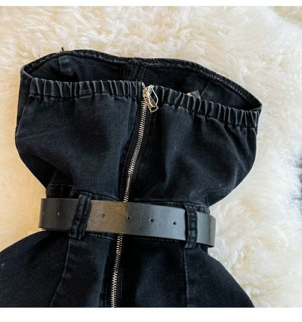 Black denim corset top with central zipper and matching belt featured in a denim jumpsuit off shoulder summer romper.