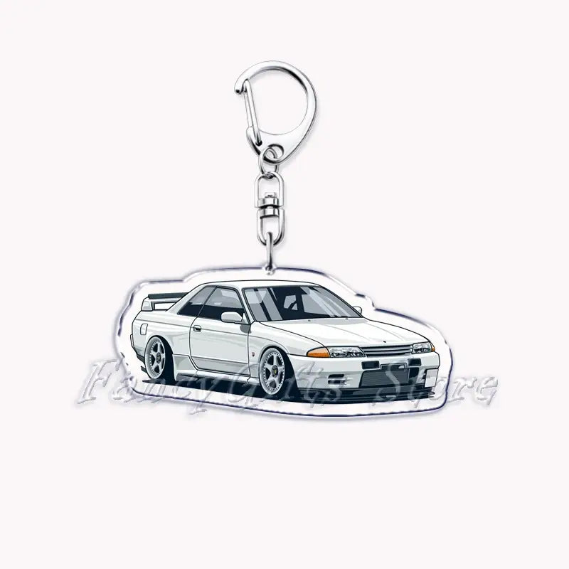 White acrylic keychain featuring a detailed illustration of a Nissan Skyline R32 GT-R for automotive accessory use.
