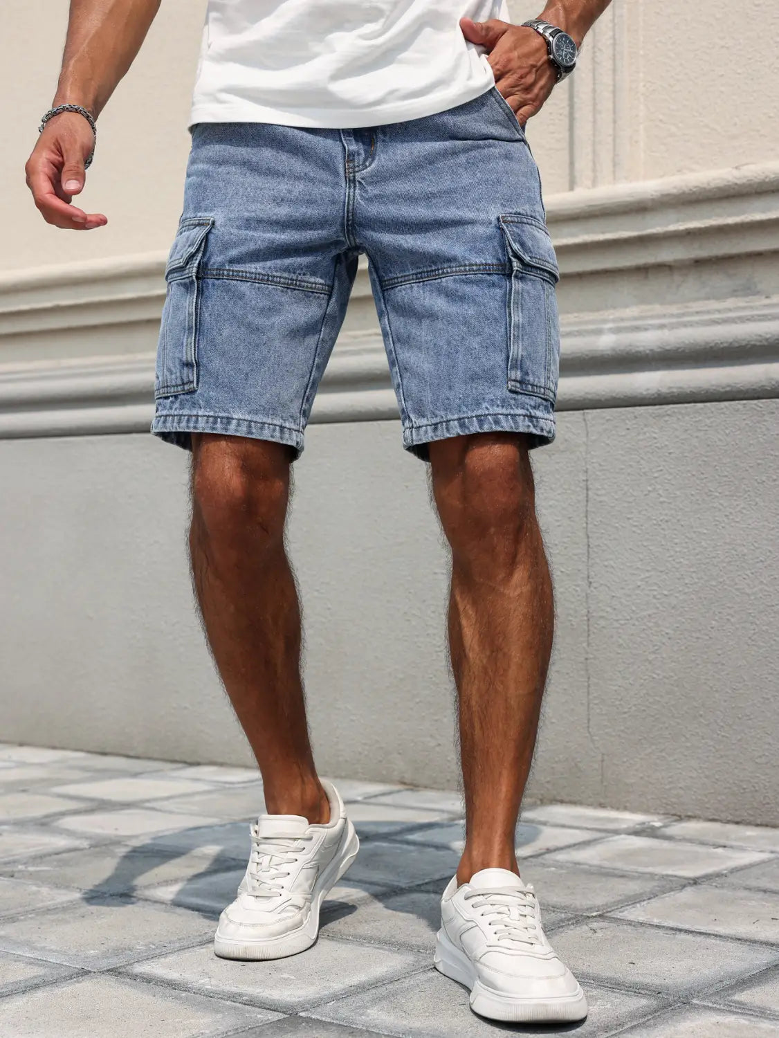 Men blue denim cargo shorts in light wash with multiple pockets and a casual relaxed regular fit.