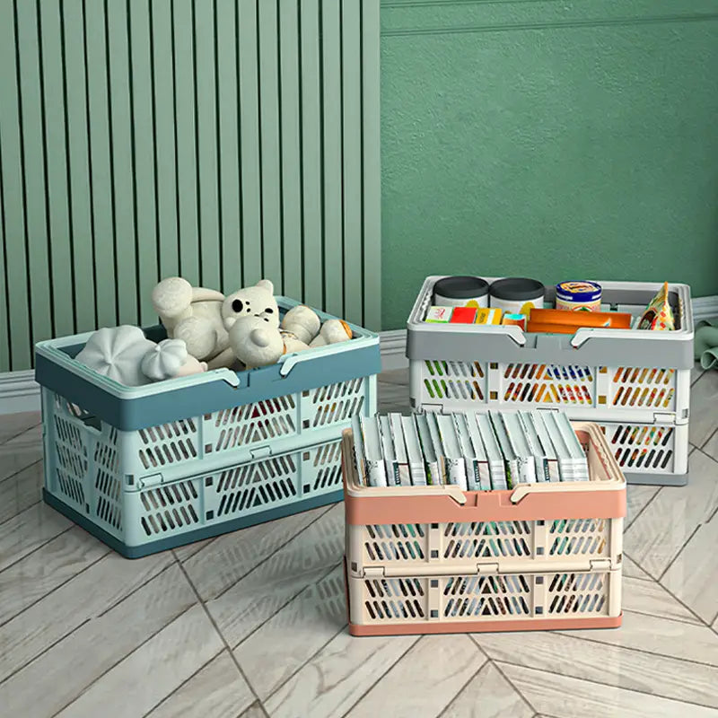 three foldable plastic storage crates in pastel blue gray and peach with a lattice design and collapsible feature