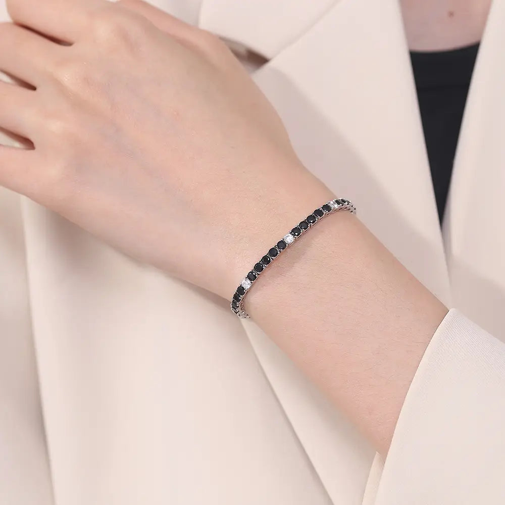 Sterling silver black cz tennis bracelet 3mm featuring a sleek design with alternating black and clear cubic zirconia stones.