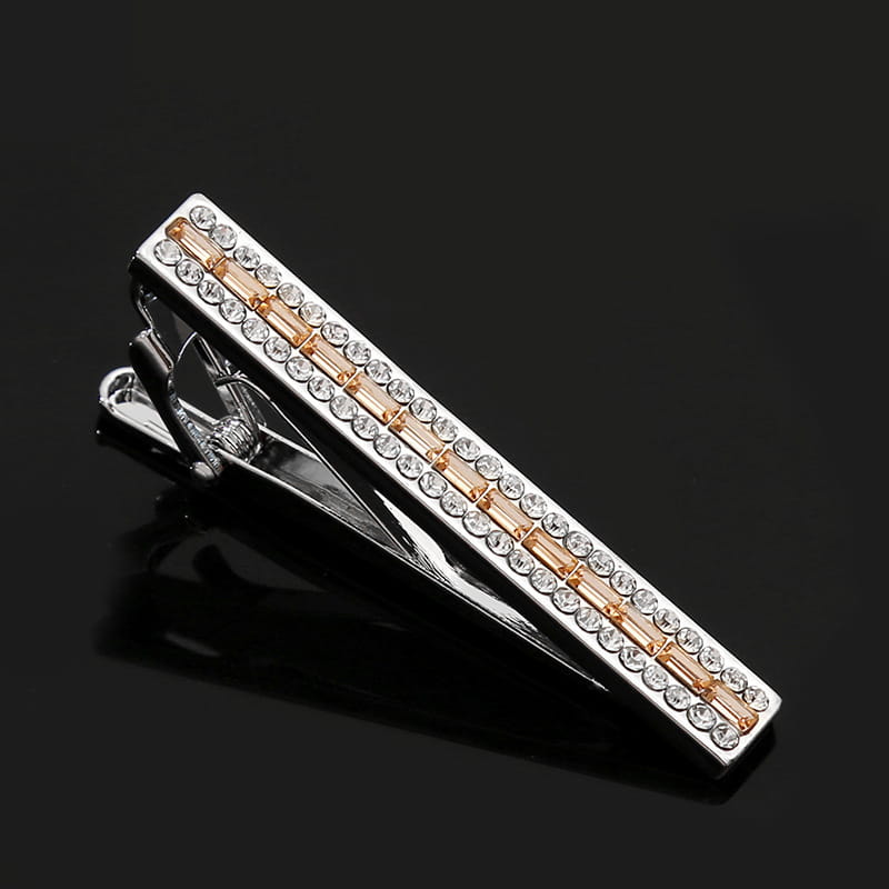 A sleek silver and rose gold crystal rhinestone tie clip adorned with rows of clear rhinestones.