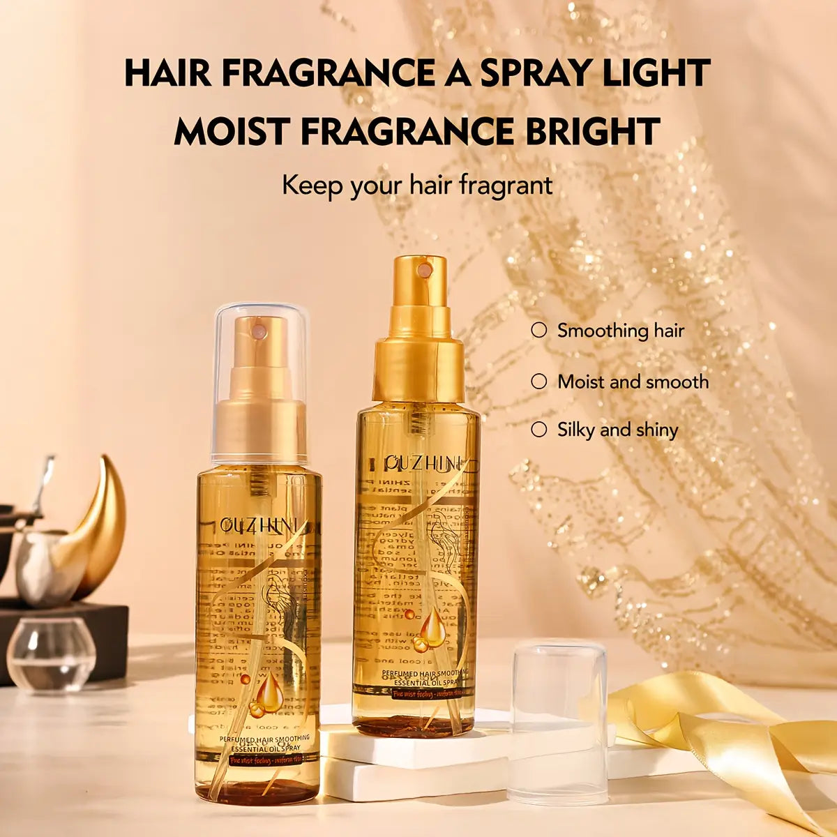 dos botellas doradas con pulverizador del spray esencial de aceite para el cuidado del cabello Ouzhin, en vidrio transparente con atomizadores de color dorado, disponibles en tamaños más altos y más bajos para uso esencial en el cuidado del cabello.