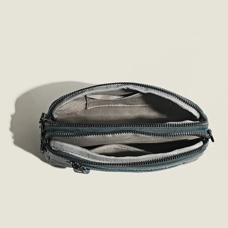 Dunkelgraue Umhängetasche aus echtem Leder für Damen mit einem schlanken, minimalistischen Design mit zwei Reißverschlüssen