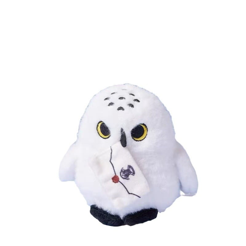 Fluffy white owl plush toy keychain featuring a white plush snowy owl figurine with yellow eyes black beak holding a small embroidered note.