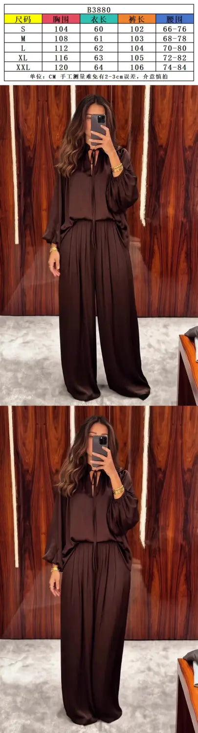 Ein eleganter dunkelbrauner Satin-Jumpsuit mit entspannter Passform und langen Ärmeln, ideal für die Frühling- und Sommersaison.