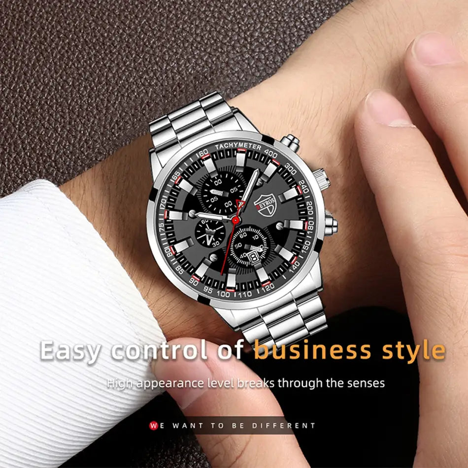 Montre pour homme Deyros en acier inoxydable noir, en quartz, dotée d’un boîtier de chronographe à tonalité argentée, d’un cadran noir et d’accents rouges sur les aiguilles et les index, complétée par un bracelet à maillons en acier inoxydable.