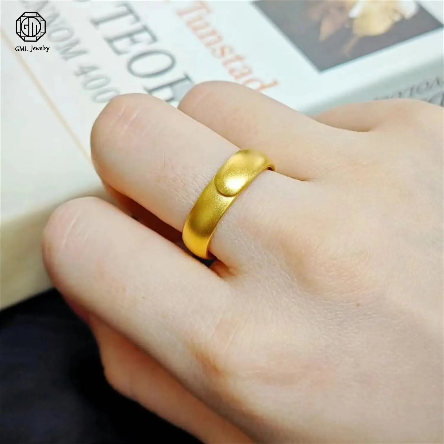 A sleek solid gold adjustable ring with a matte wide band and a subtle raised circular detail featuring fade resistant sand gold adjustable finish.